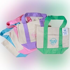 Trader Joe’s mini pastel canvas tote bags in pink blue green purple